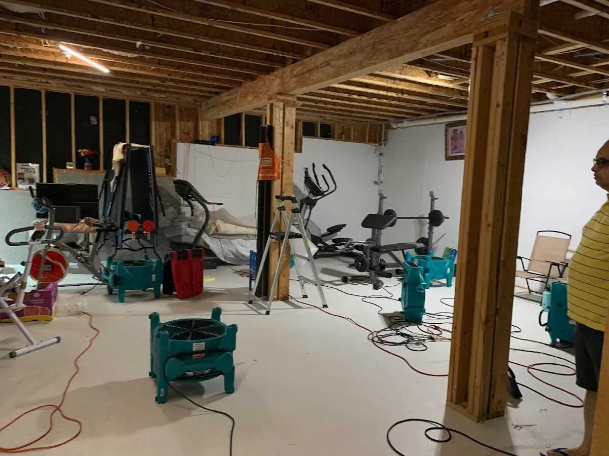 Basement drying equipment setup for Contents Cleaning & Restoration in Coshocton